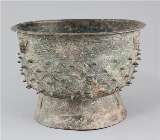 A Chinese archaic bronze ritual food vessel, Yu, Shang dynasty, Anyang type, 17cm high, 25.5cm diameter, crack